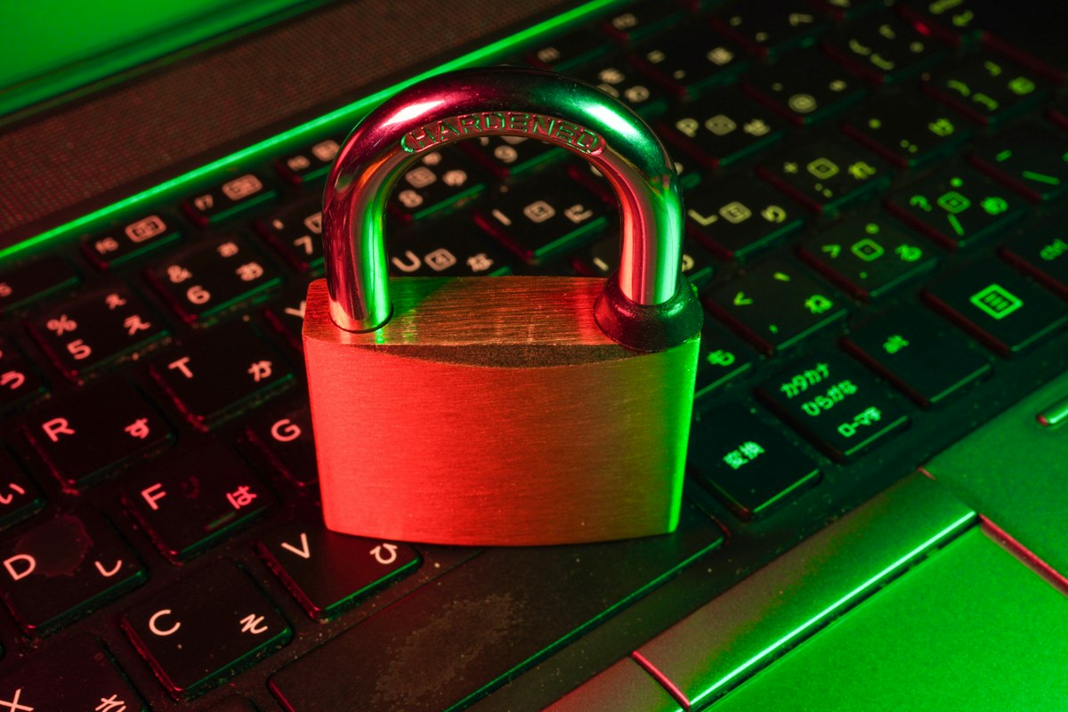 Cybersecurity lock on a digital circuit board, symbolizing the two chained CVEs that turned session hijacking into root access