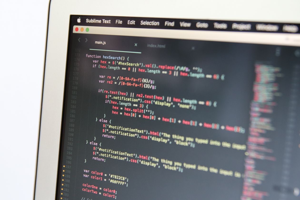 Code on a laptop screen — the building block every scraper ends with