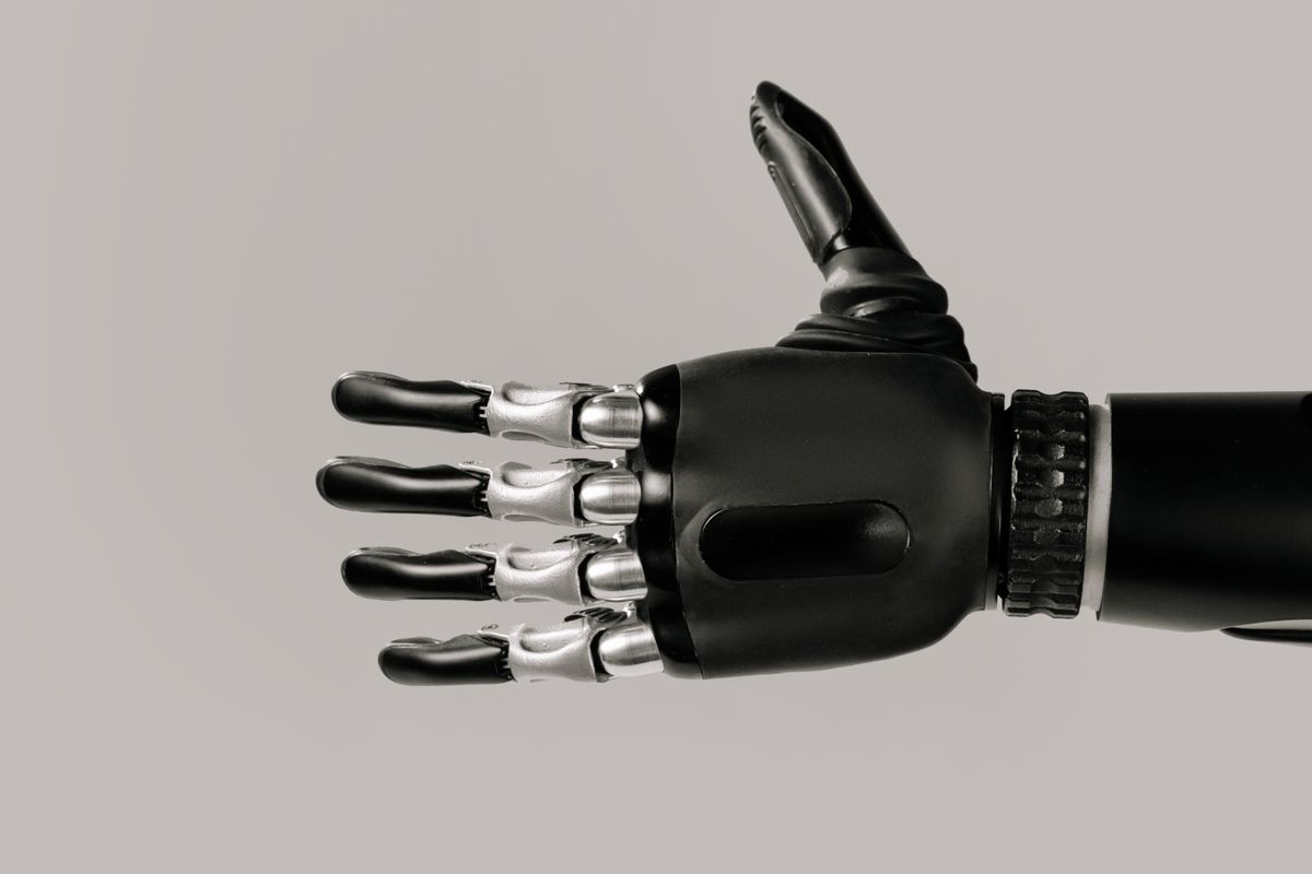 Abstract robot hand reaching toward a glowing surface, representing autonomous agents acting beyond their assigned scope