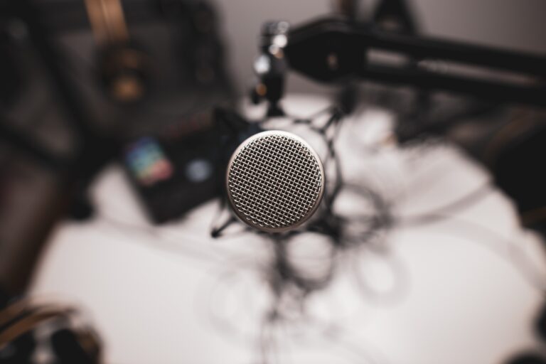 A professional podcast microphone in a recording studio — the kind of audio quality bar voice agents are now expected to match