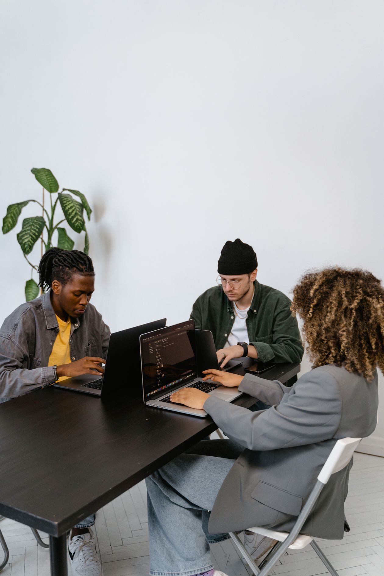 Team collaborating around a table — the automation culture panel's human side of scaling agents