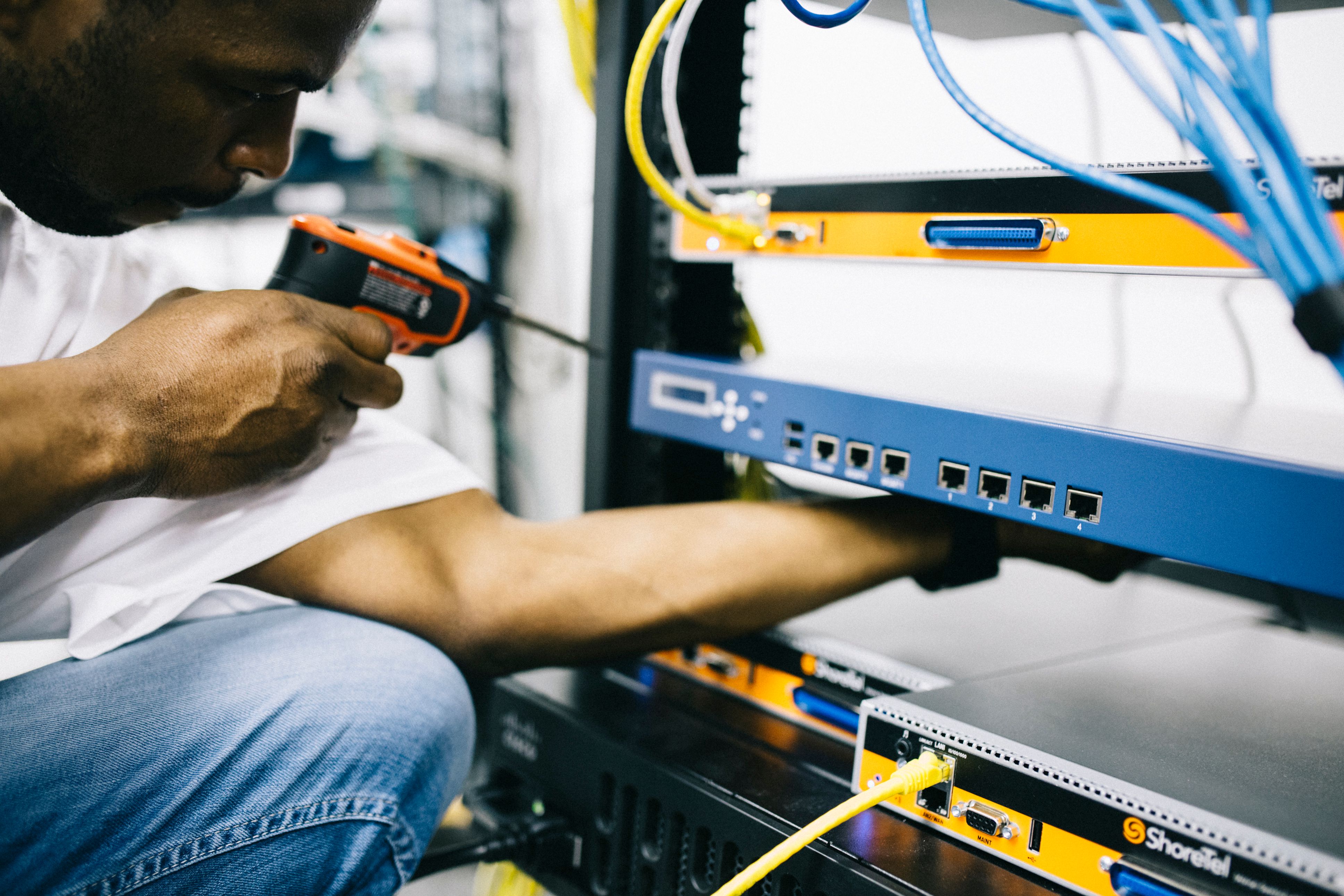 A technician repairing server hardware in a data center