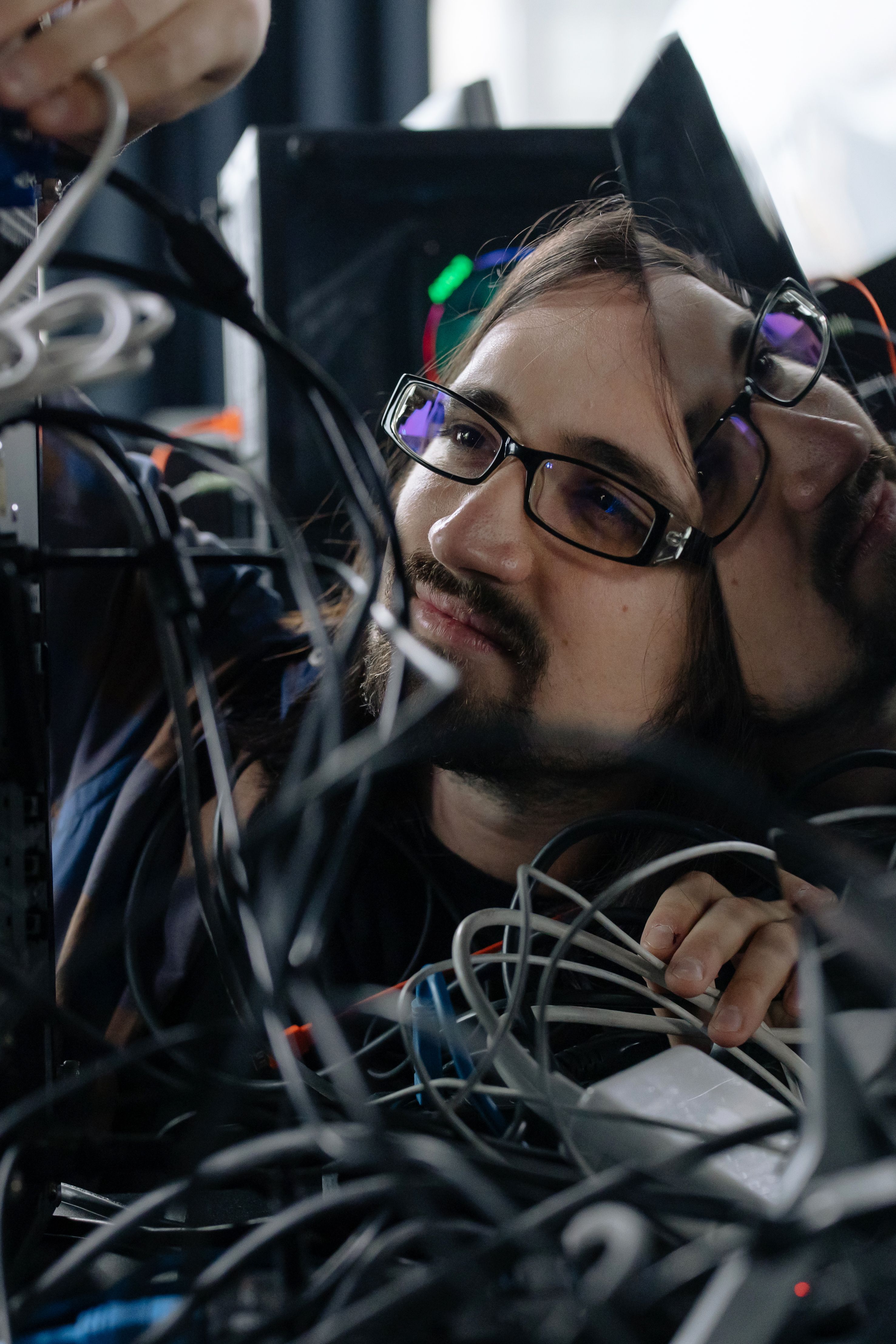 A system administrator organizing network cables