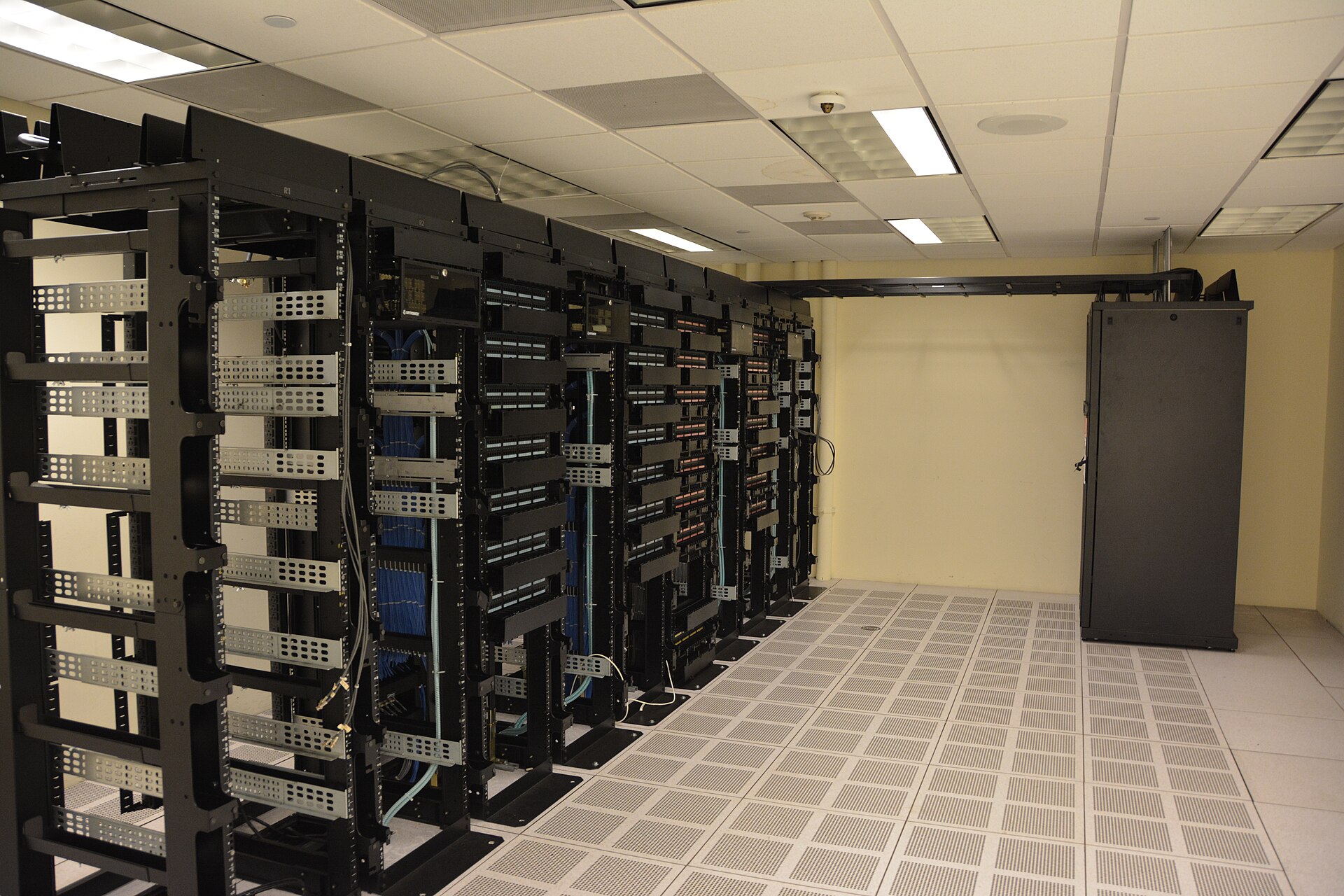 Rows of server racks in a data center — the infrastructure layer where autonomous agents increasingly run