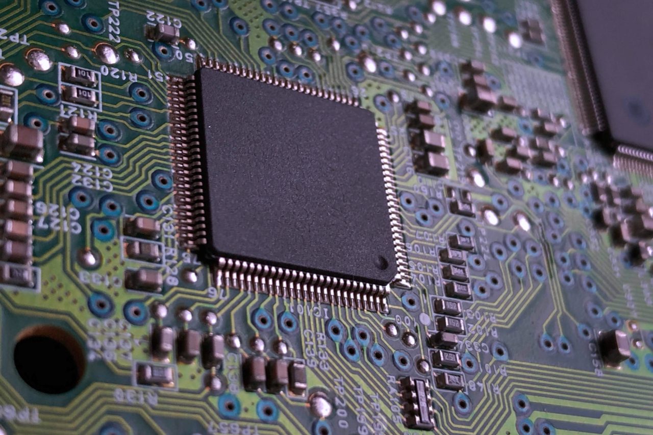 Close-up of a computer processor on a circuit board — RTX Spark pairs a 20-core Grace CPU with a Blackwell RTX GPU and up to 128GB of shared memory