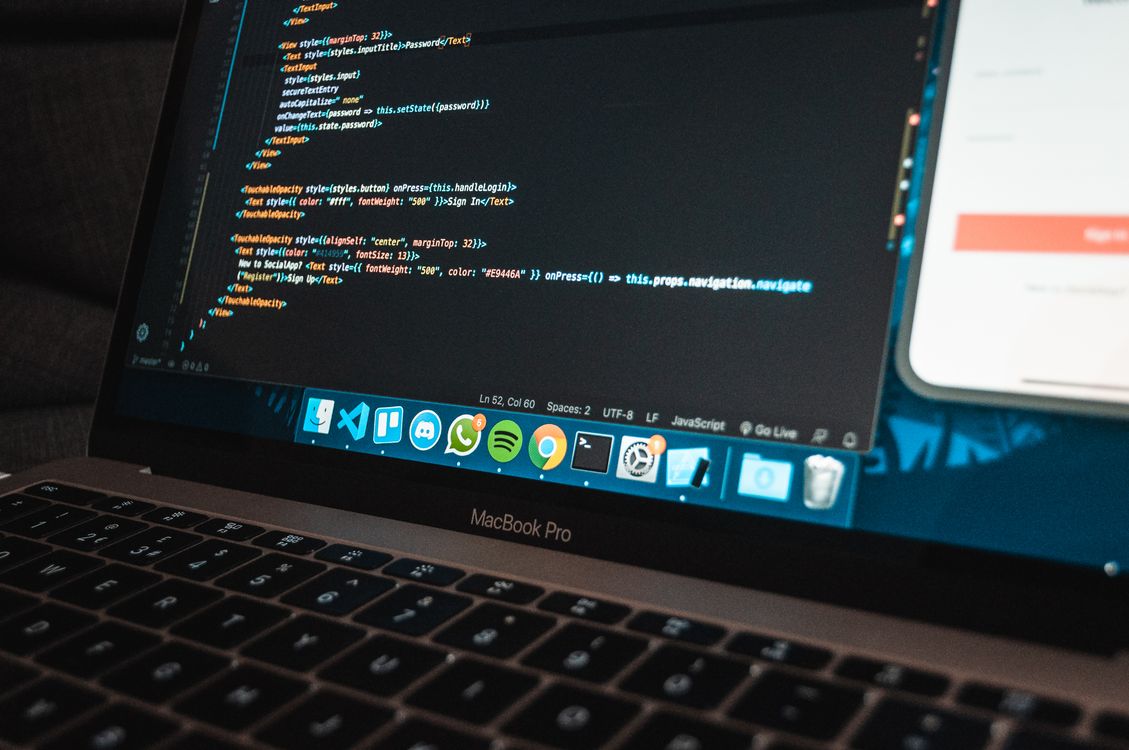 A laptop showing program code on screen — the kind of place where dead OpenAI model strings hide in your workflow exports