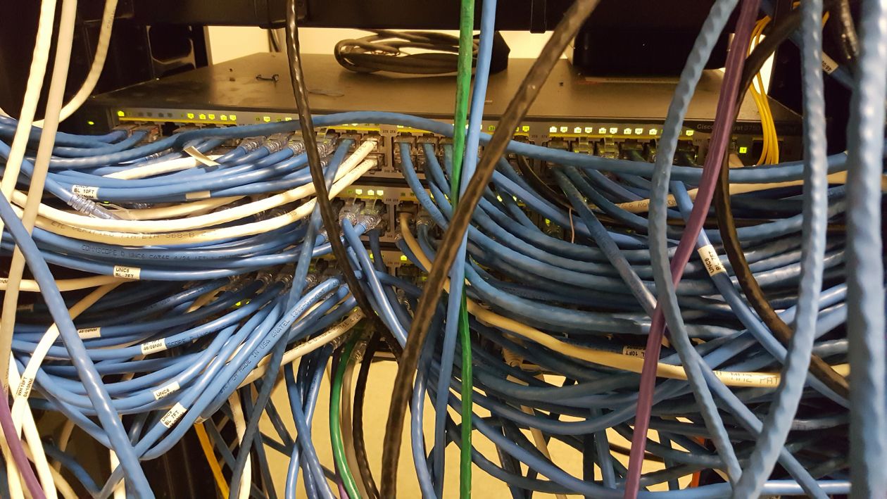 Close-up of network switch cables — every token request the SDK sends travels this kind of path, and CVE-2026-89111 let attackers reroute it