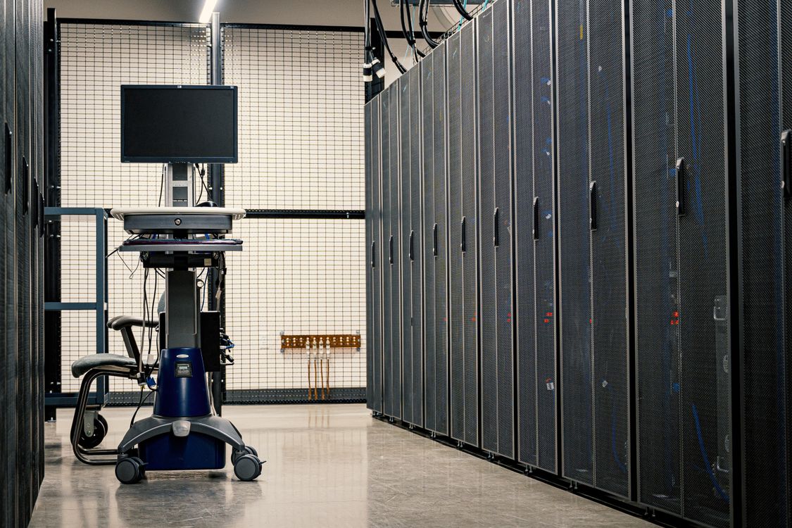 Aisle of server racks in a data center — the kind of cloud infrastructure the rogue agents ran on
